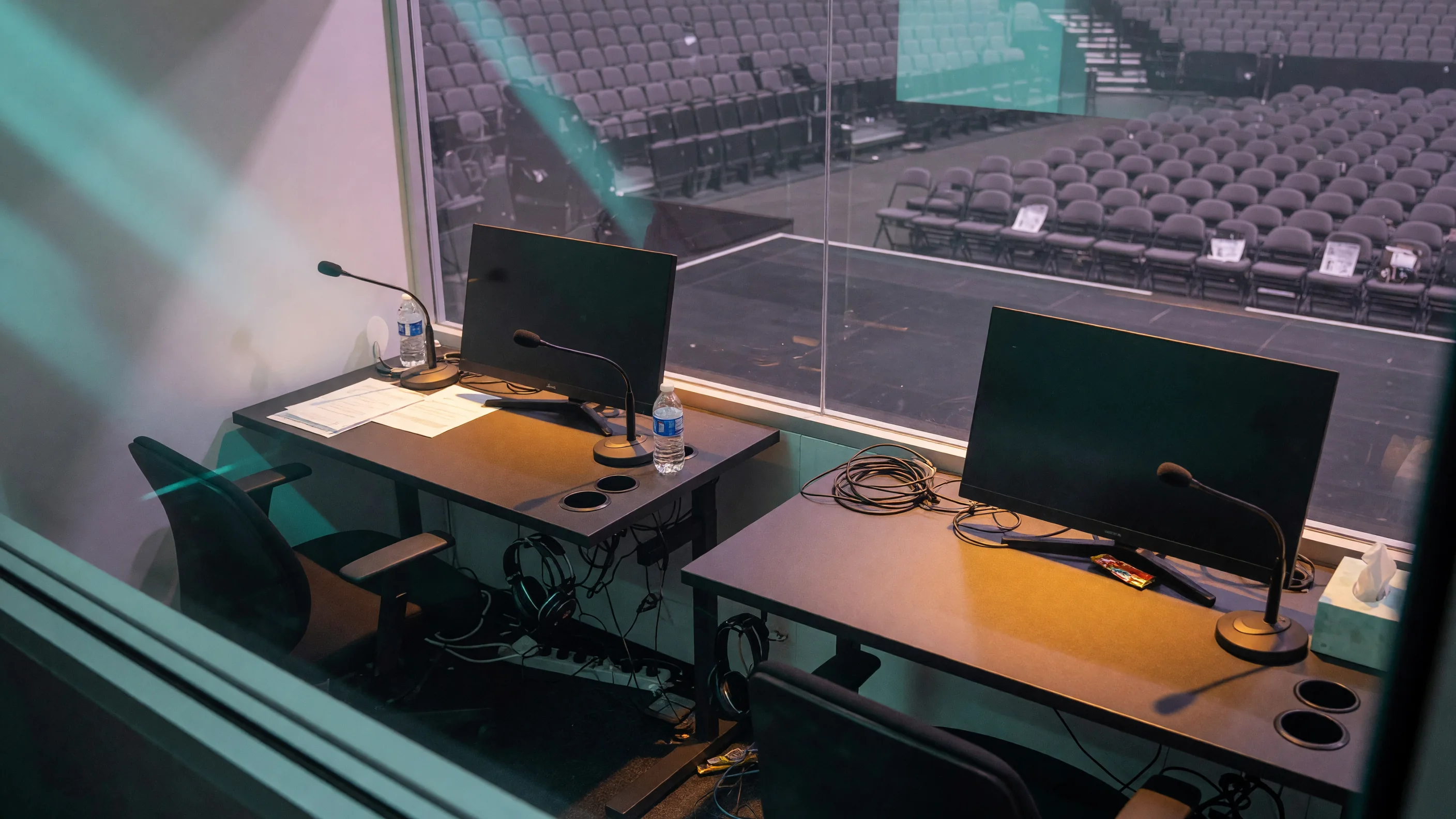 Caster booth with muted microphones